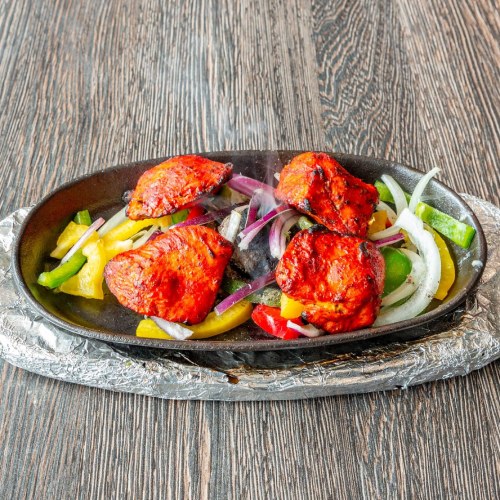Rangoli Restaurant Sizzling Chicken Tikka Pieces in East Kilbride.